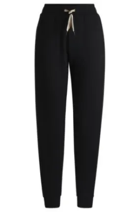 Cuffed tracksuit bottoms with signature-stripe drawcord