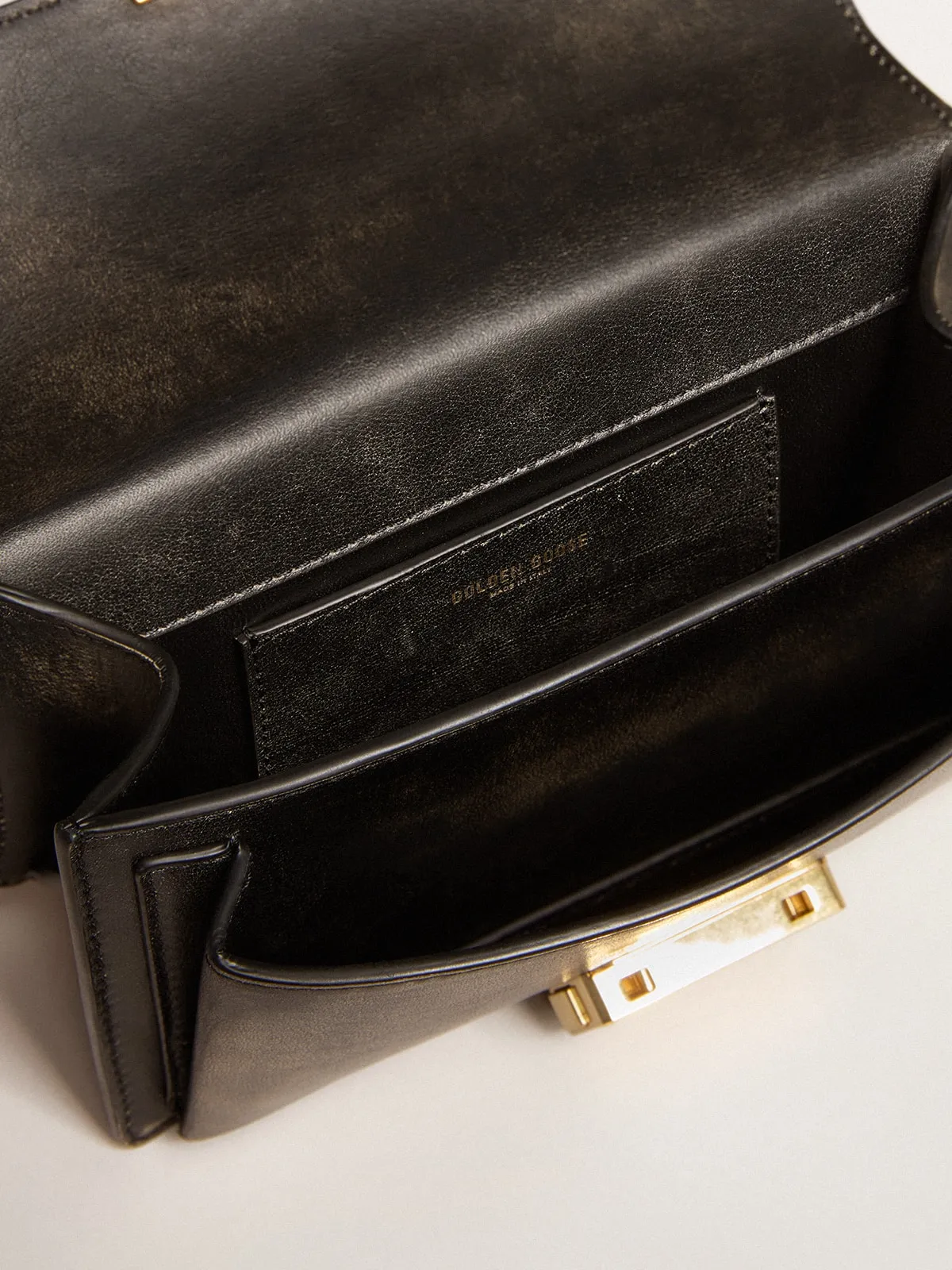 Small Venezia Bag in black distressed leather with gold details